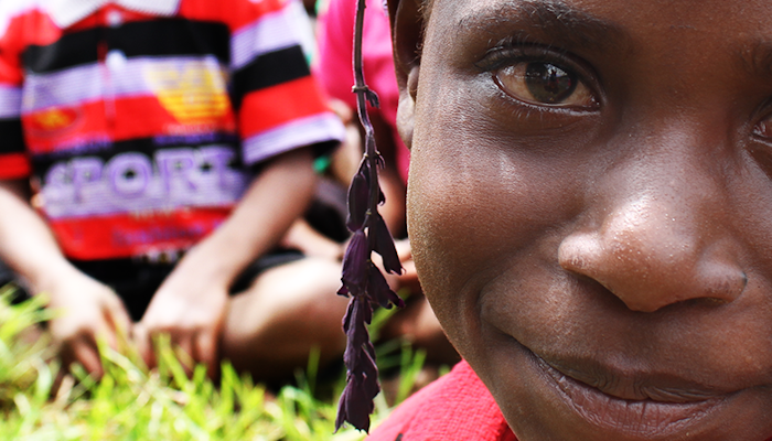 A young girl from Papua New Guinea smiling